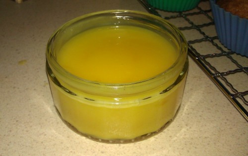 A glass ramekin of lemon curd