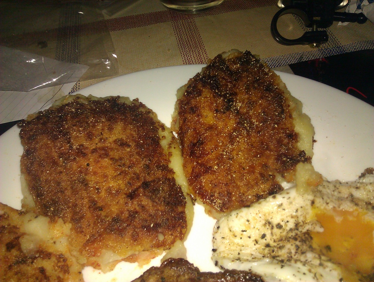 Spudcakes Two crispy spud cakes beside a lovely soft fried egg